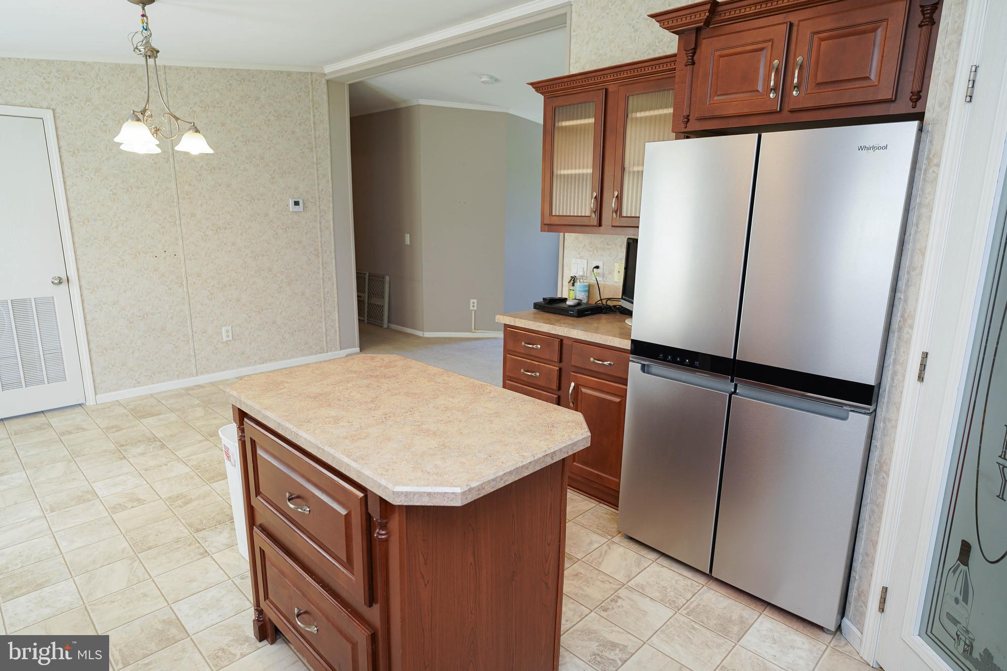 5846 Puckum Road Rhodesdale, MD 21659 - Photo 13 of 32 a kitchen with stainless steel appliances a refrigerator and a stove