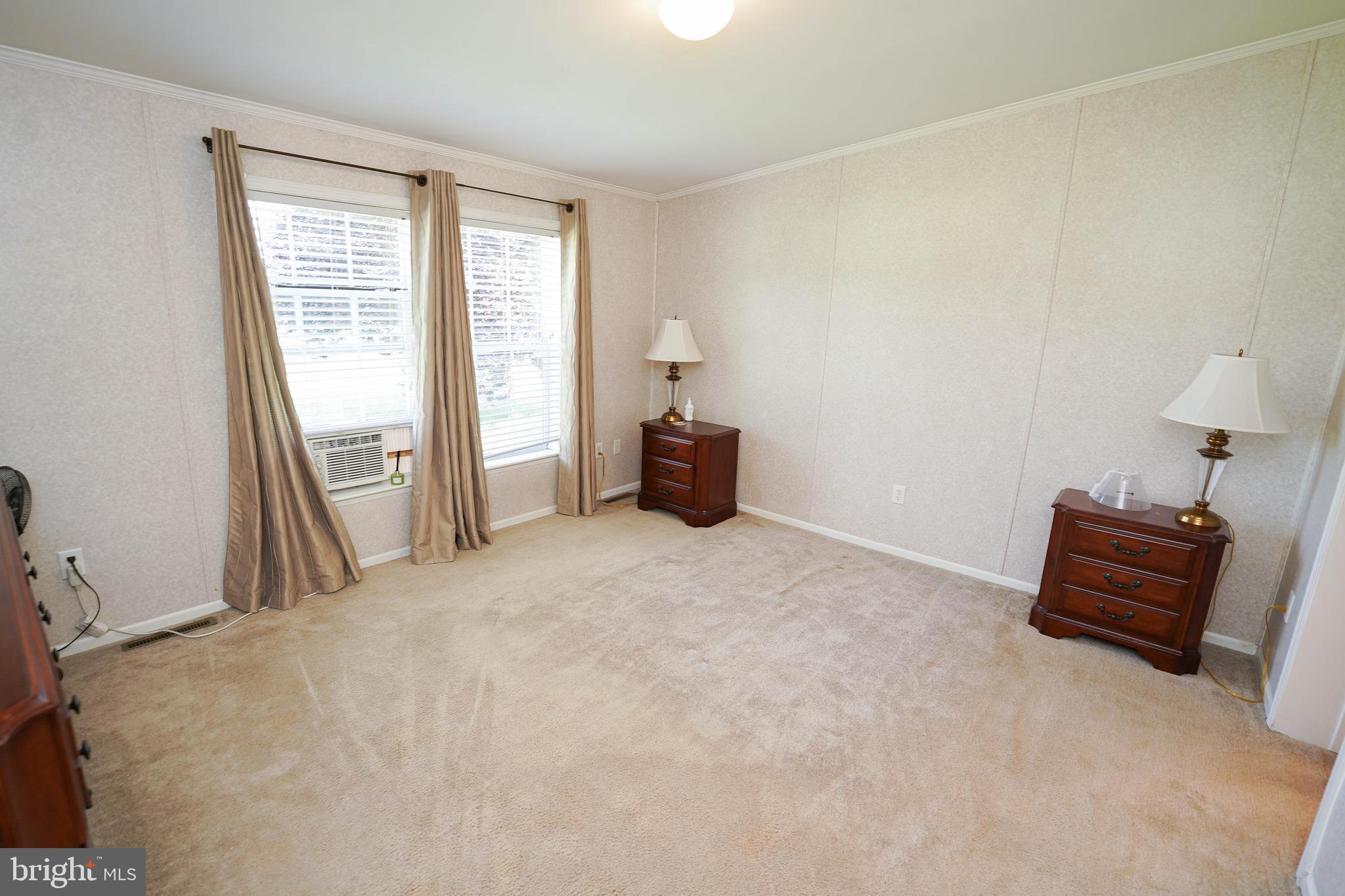 5846 Puckum Road Rhodesdale, MD 21659 - Photo 17 of 32 a bedroom with a bed and a window