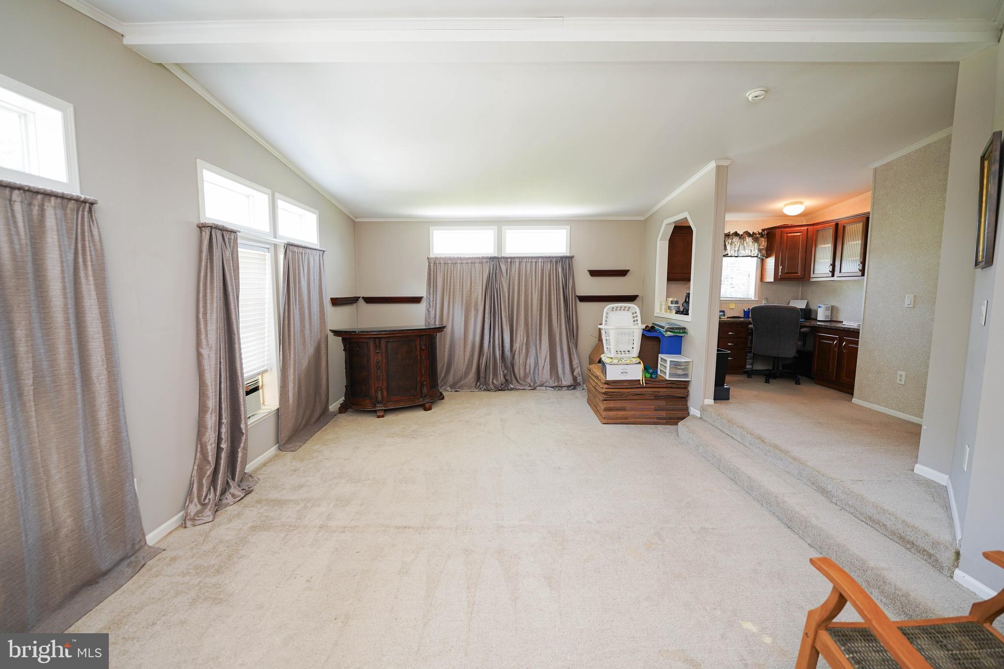 5846 Puckum Road Rhodesdale, MD 21659 - Photo 25 of 32 a view of a livingroom with furniture and a flat screen tv