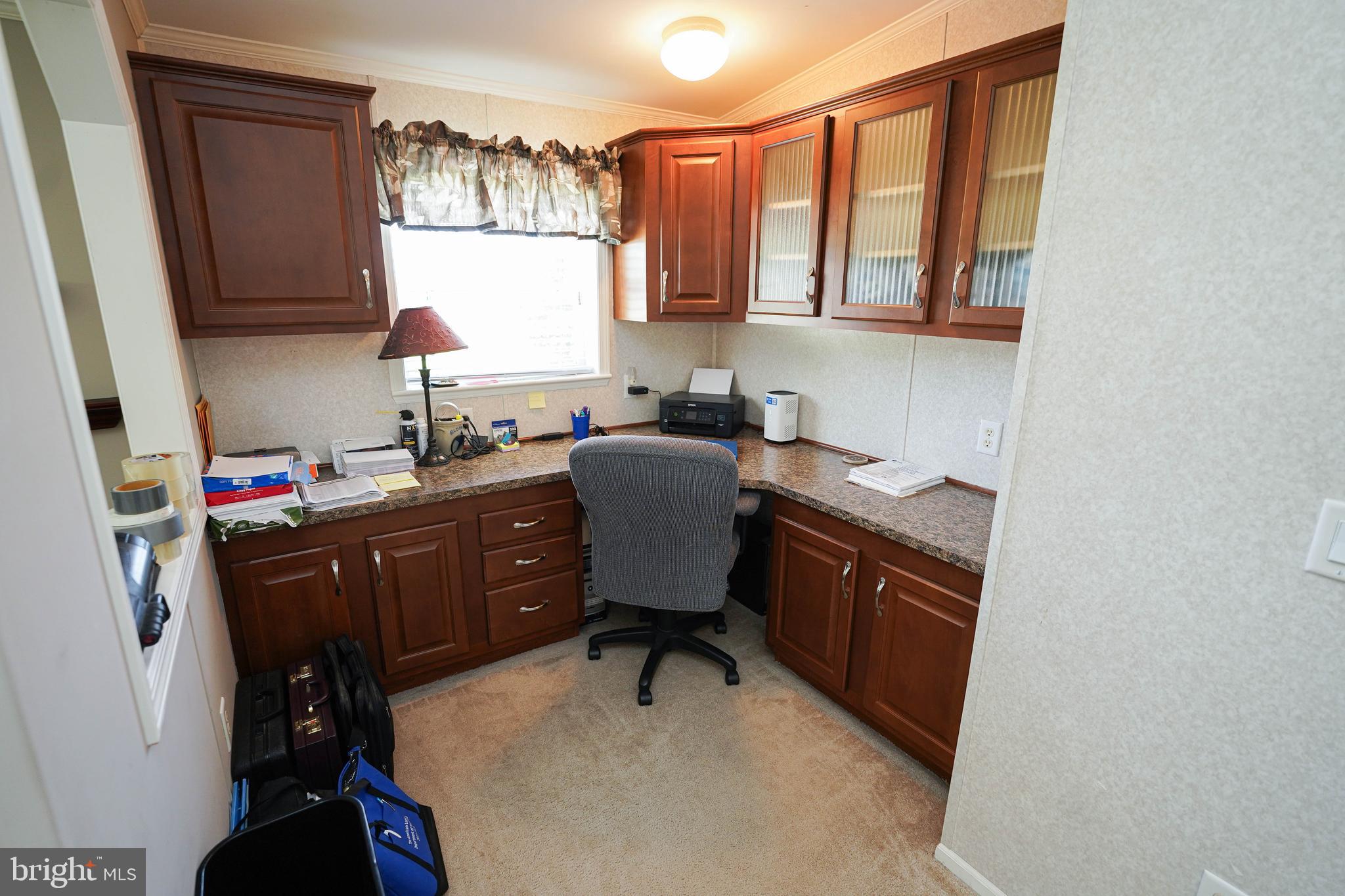 5846 Puckum Road Rhodesdale, MD 21659 - Photo 26 of 32 a view of a workspace with furniture and a window