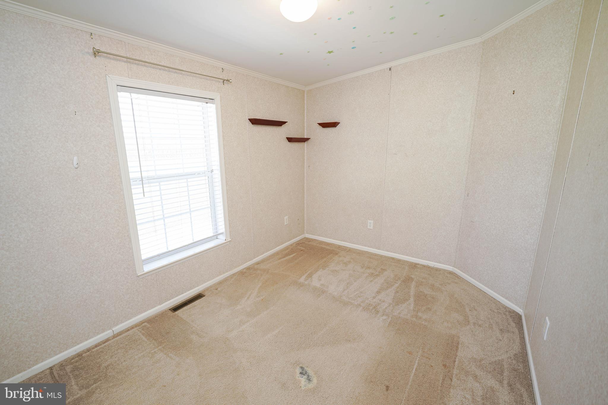 5846 Puckum Road Rhodesdale, MD 21659 - Photo 28 of 32 an empty room with a window