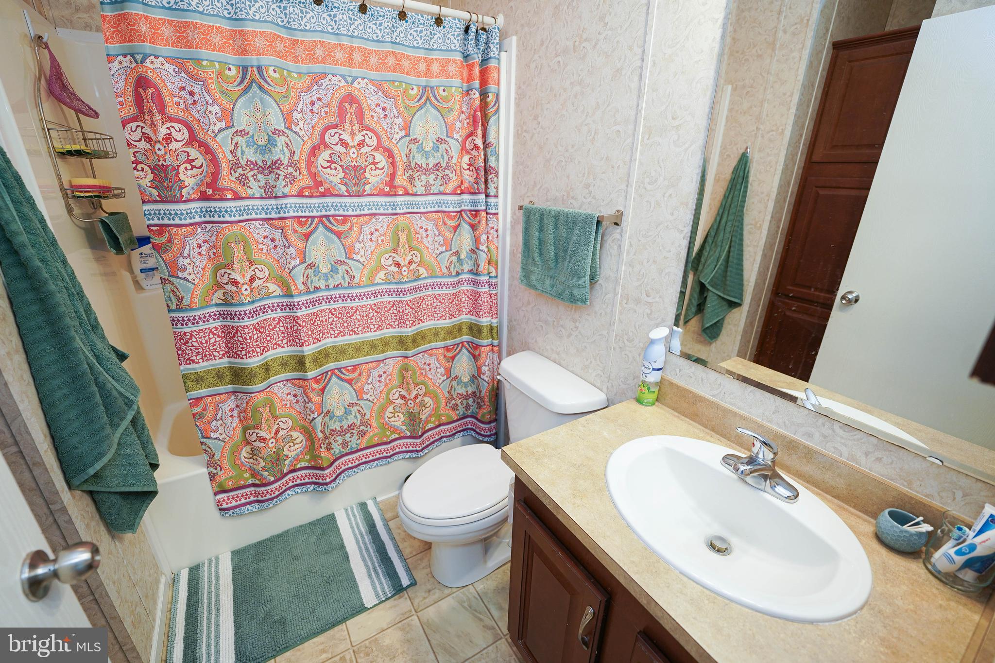 5846 Puckum Road Rhodesdale, MD 21659 - Photo 30 of 32 a bathroom with a sink and a mirror
