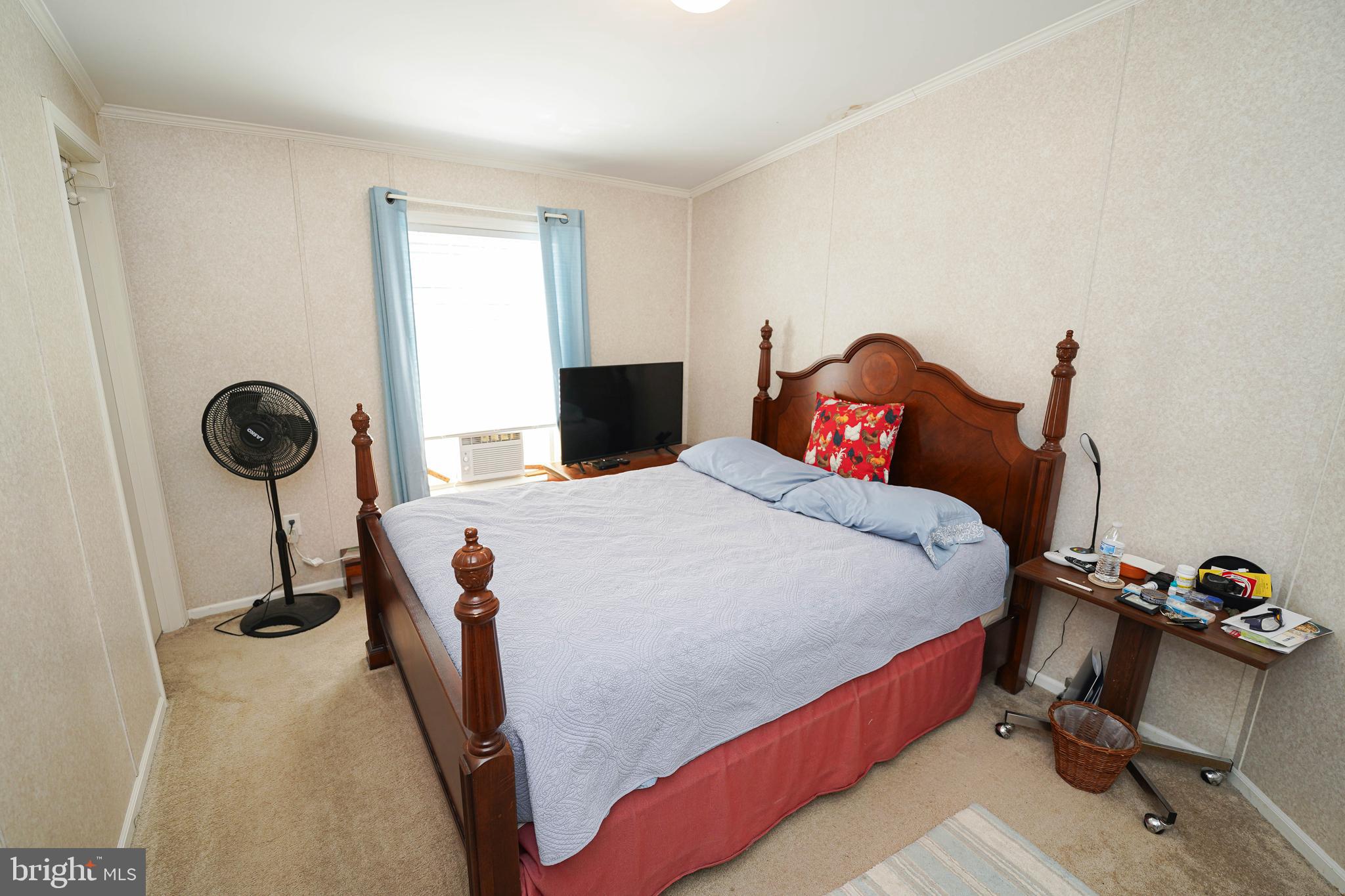 5846 Puckum Road Rhodesdale, MD 21659 - Photo 31 of 32 a bed room with a bed and a chair