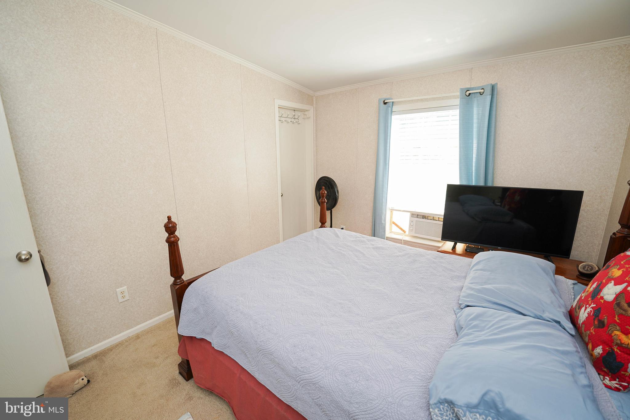 5846 Puckum Road Rhodesdale, MD 21659 - Photo 32 of 32 a bedroom with a bed and a window