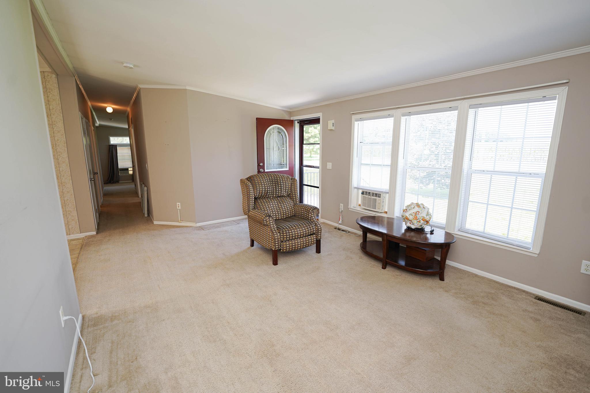 5846 Puckum Road Rhodesdale, MD 21659 - Photo 6 of 32 a living room with furniture and a large window