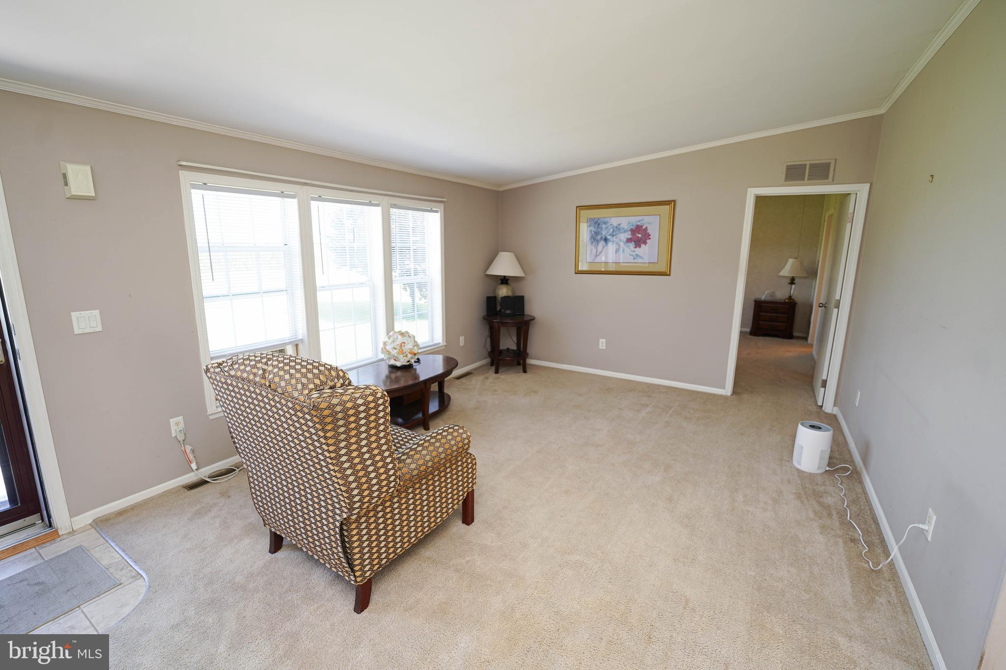 5846 Puckum Road Rhodesdale, MD 21659 - Photo 7 of 32 a living room with furniture and a window