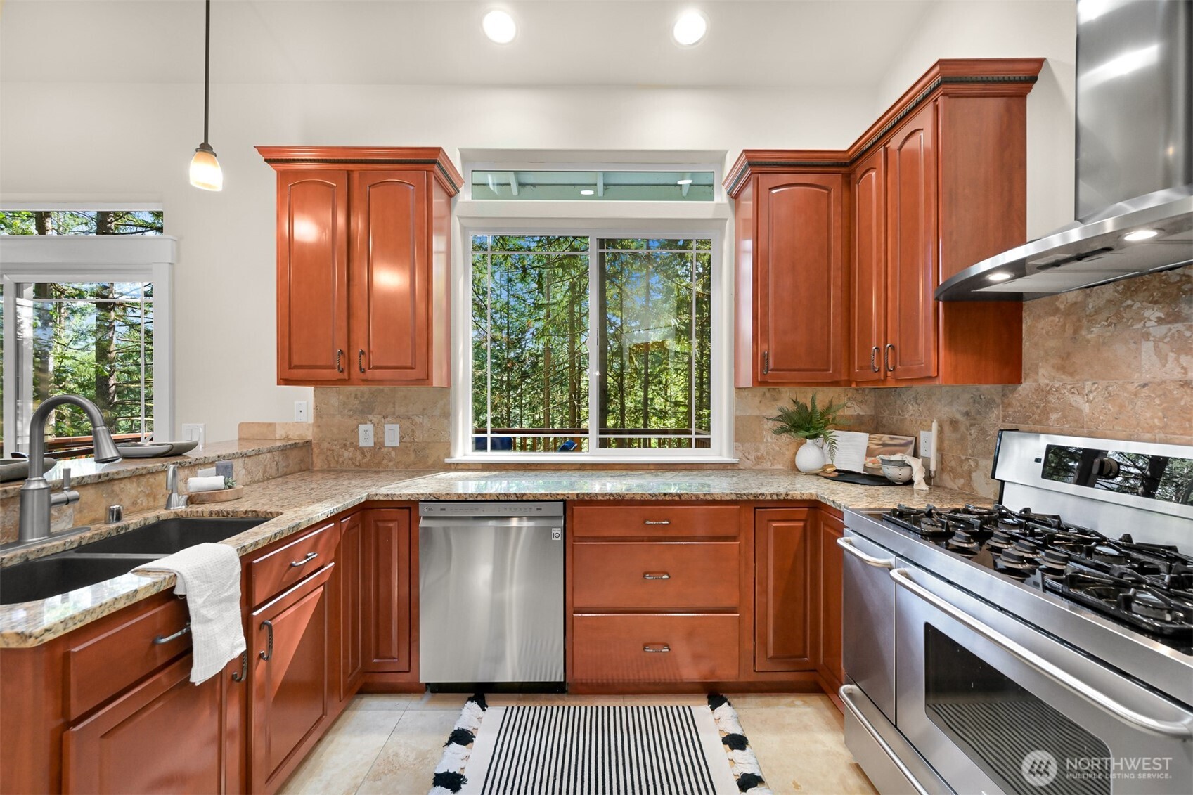 14 Gooseberry Circle Bellingham, WA 98229 - Photo 14 of 40 a kitchen with a sink stove top oven and cabinets