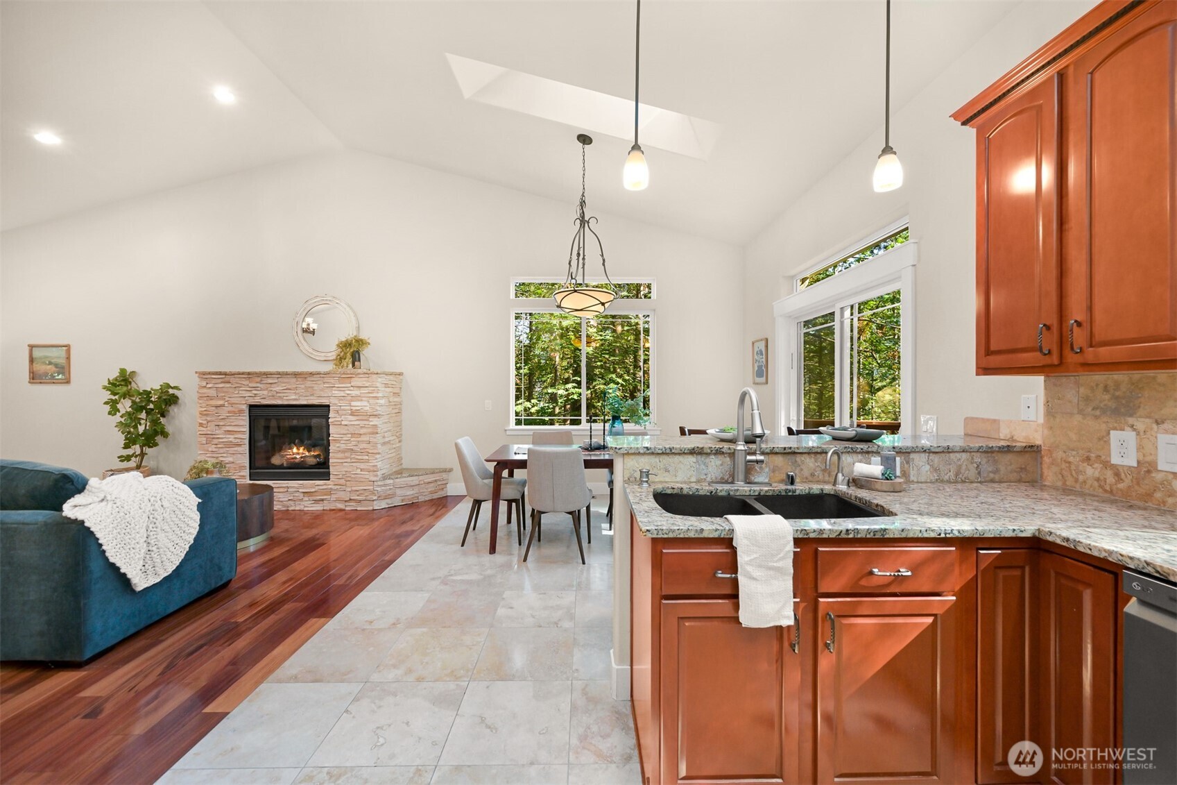 14 Gooseberry Circle Bellingham, WA 98229 - Photo 16 of 40 a kitchen with stainless steel appliances granite countertop wooden cabinets a dining table and chairs