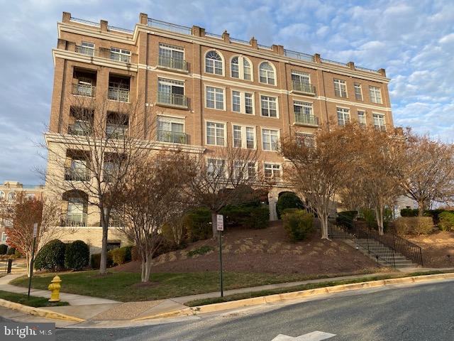 820 Belmont Bay Drive, Unit 301 Woodbridge, VA 22191 - Photo 2 of 76 Elegant brick building with lush landscaping.