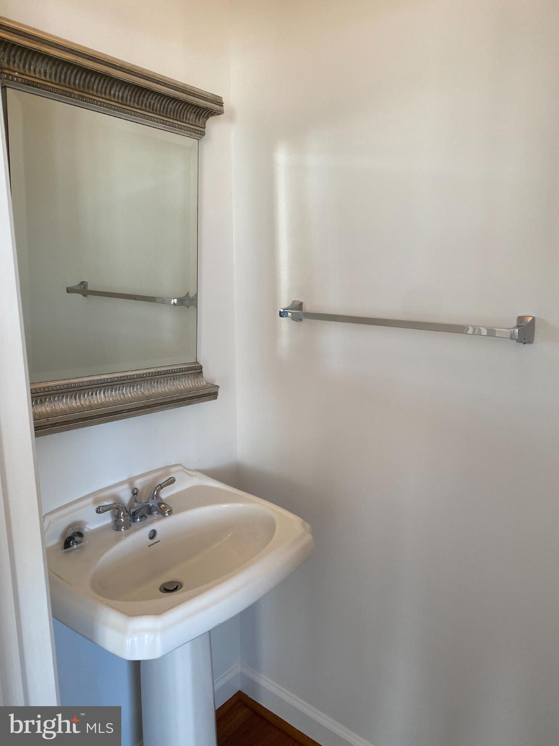 820 Belmont Bay Drive, Unit 301 Woodbridge, VA 22191 - Photo 23 of 76 Elegant powder room with classic mirror.
