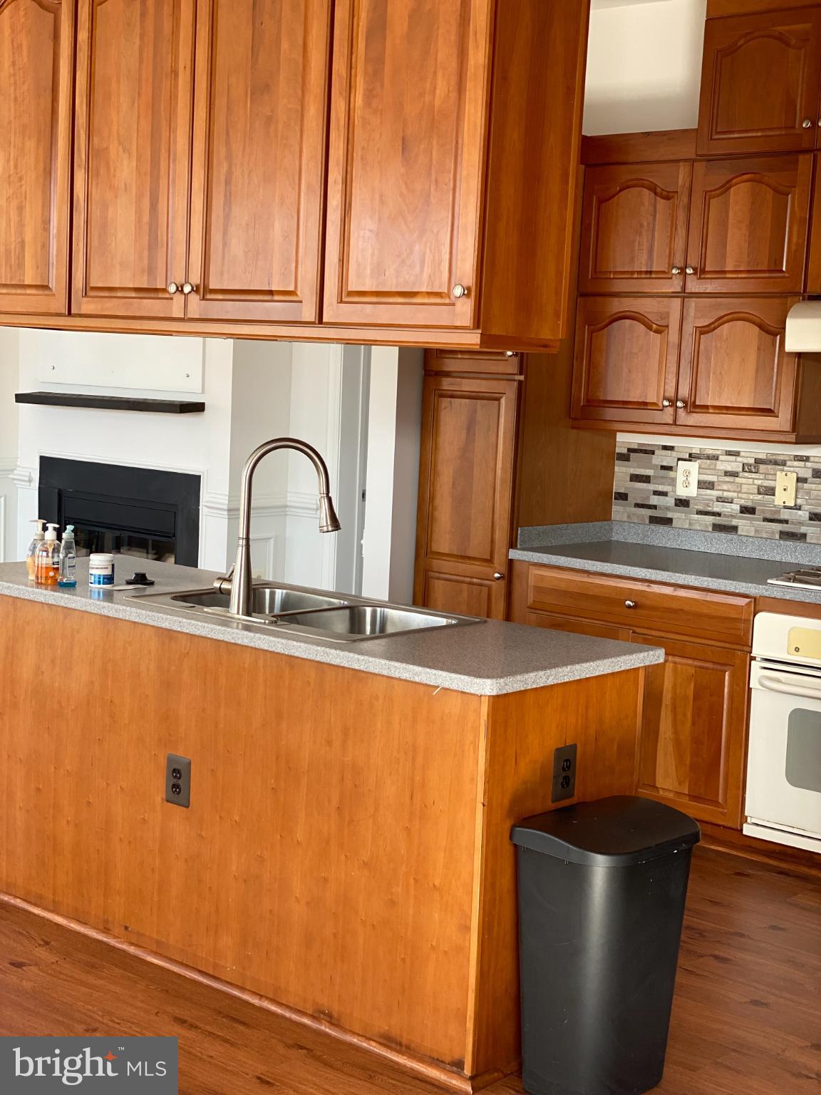 820 Belmont Bay Drive, Unit 301 Woodbridge, VA 22191 - Photo 30 of 76 Warm wood tones in a cozy kitchen space.