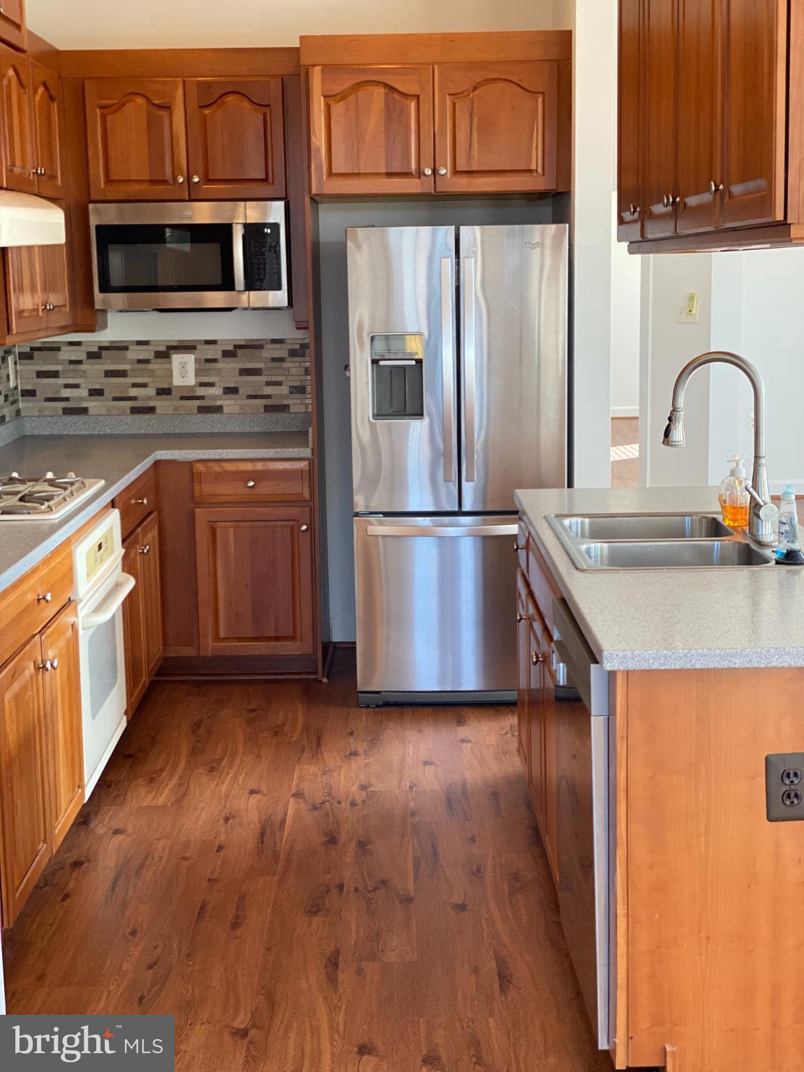 820 Belmont Bay Drive, Unit 301 Woodbridge, VA 22191 - Photo 33 of 76 Modern kitchen with warm wood accents.