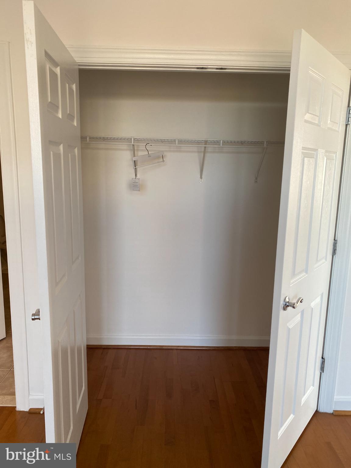 820 Belmont Bay Drive, Unit 301 Woodbridge, VA 22191 - Photo 41 of 76 Spacious closet with double doors ajar.