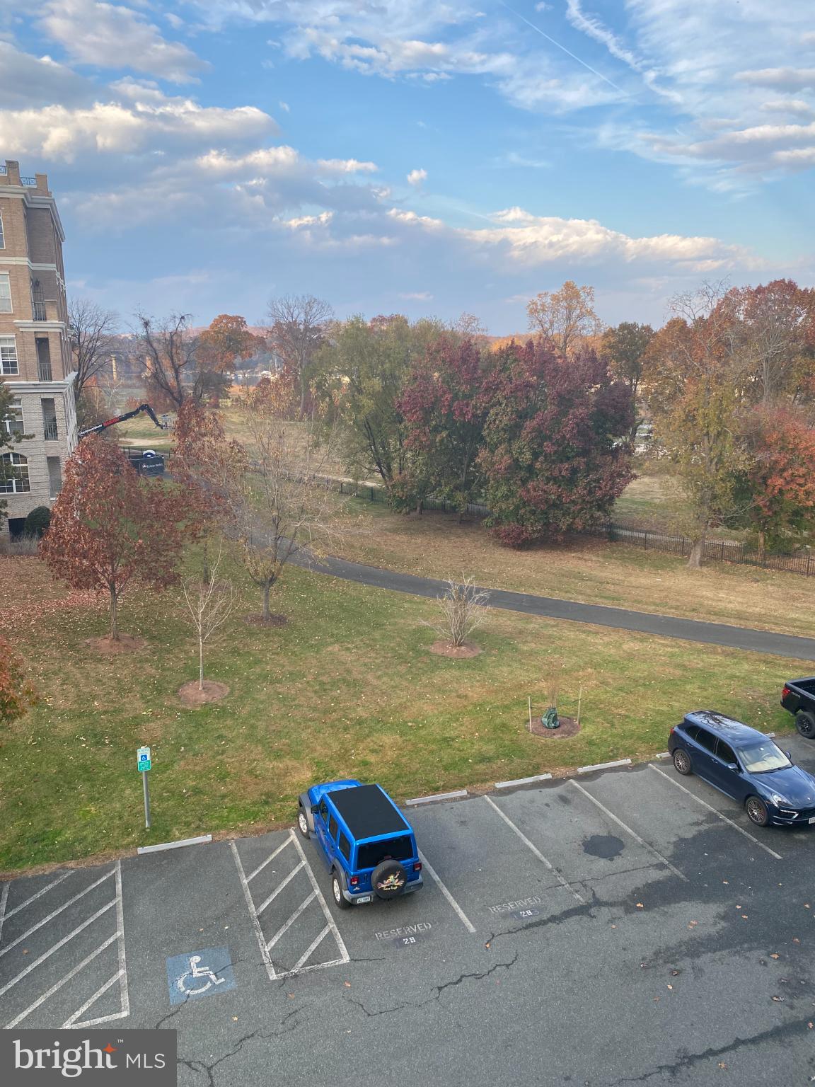 820 Belmont Bay Drive, Unit 301 Woodbridge, VA 22191 - Photo 48 of 76 Serene autumn view with vibrant foliage.