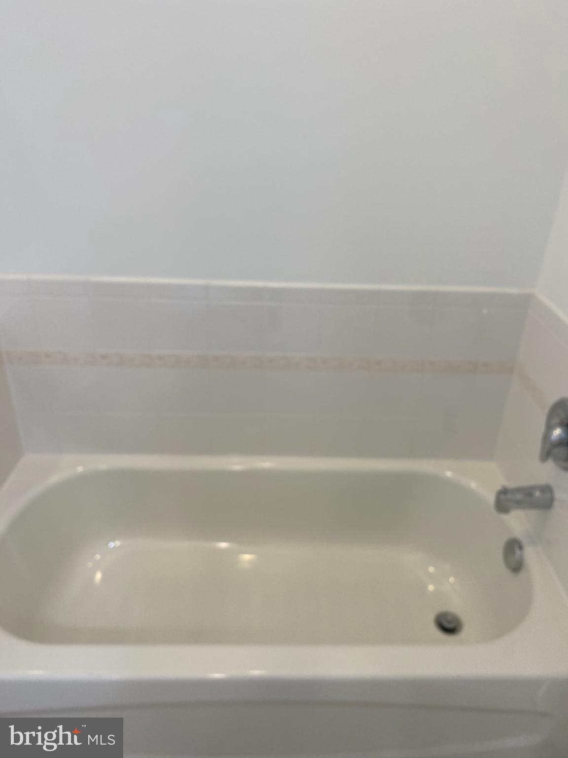 820 Belmont Bay Drive, Unit 301 Woodbridge, VA 22191 - Photo 49 of 76 Serene bathtub for ultimate relaxation.