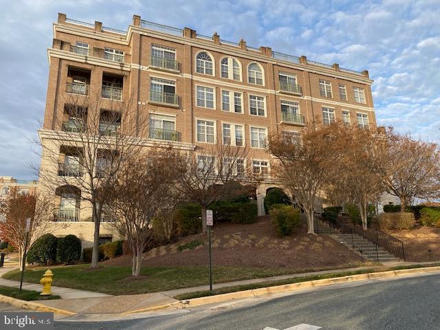 820 Belmont Bay Drive, Unit 301 Woodbridge, VA 22191 - Photo 61 of 76 Elegant brick building with lush landscaping.
