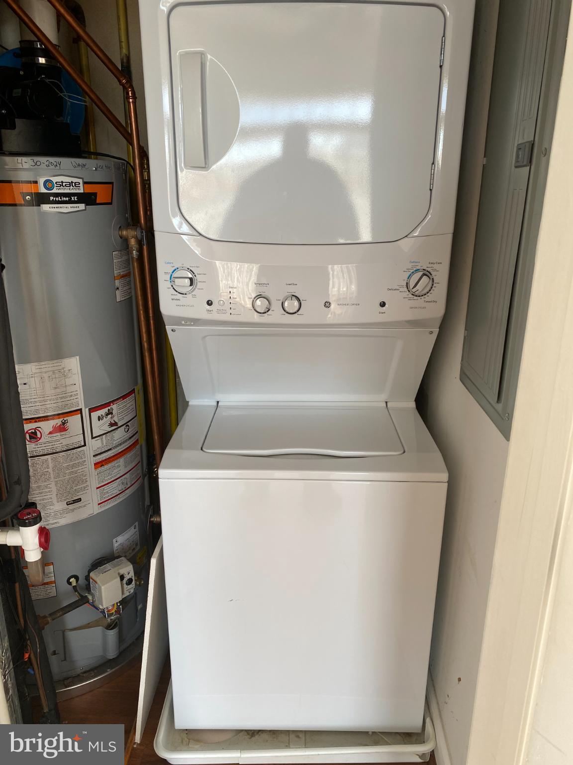 820 Belmont Bay Drive, Unit 301 Woodbridge, VA 22191 - Photo 65 of 76 Compact laundry solution in a cozy space.