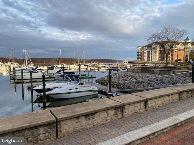 820 Belmont Bay Drive, Unit 301 Woodbridge, VA 22191 - Photo 67 of 76 Serene marina at dusk, boats gently swaying.