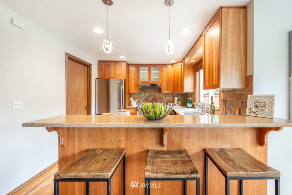 560 North 76th Street Seattle, WA 98103 - Photo 15 of 37 a close view of dining table chairs and window