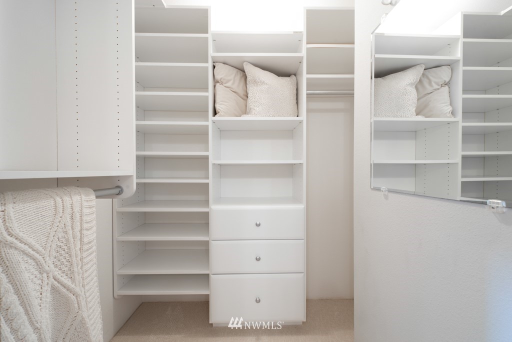 560 North 76th Street Seattle, WA 98103 - Photo 26 of 37 a view of walk in closet with empty racks