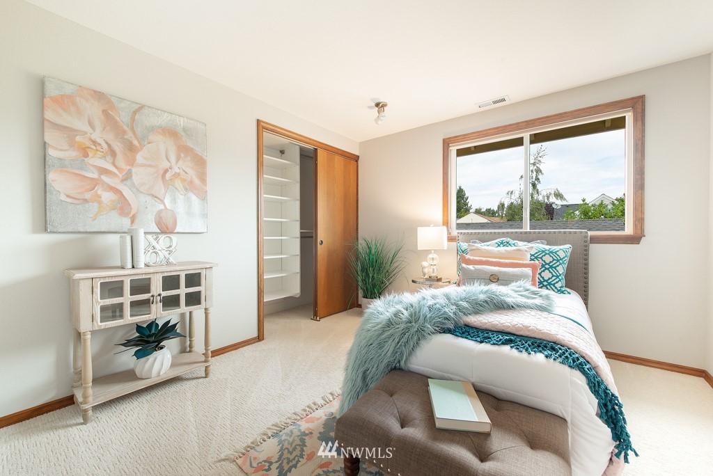 560 North 76th Street Seattle, WA 98103 - Photo 27 of 37 a bedroom with a bed and a window