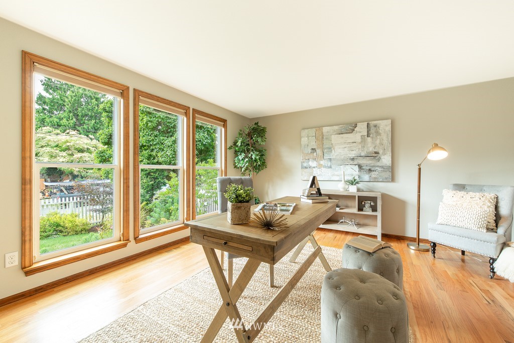 560 North 76th Street Seattle, WA 98103 - Photo 4 of 37 a living room with furniture and a large window