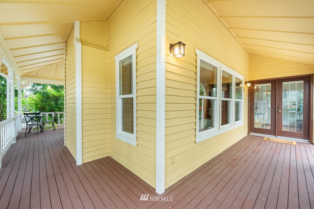 560 North 76th Street Seattle, WA 98103 - Photo 32 of 37 a view of a porch with wooden floor and furniture