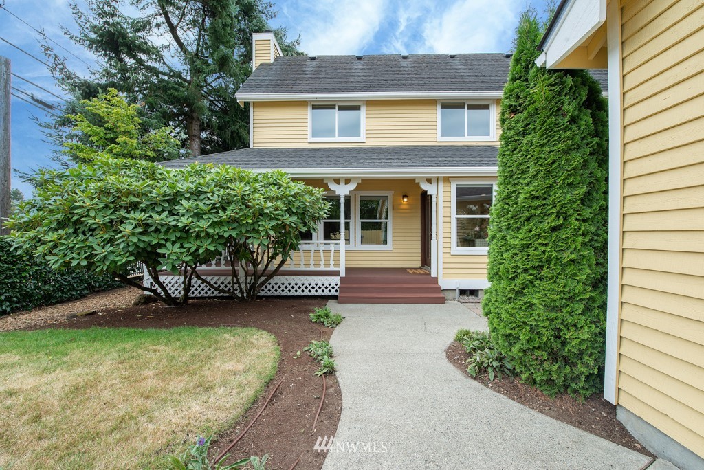 560 North 76th Street Seattle, WA 98103 - Photo 34 of 37 front view of a house with a garden