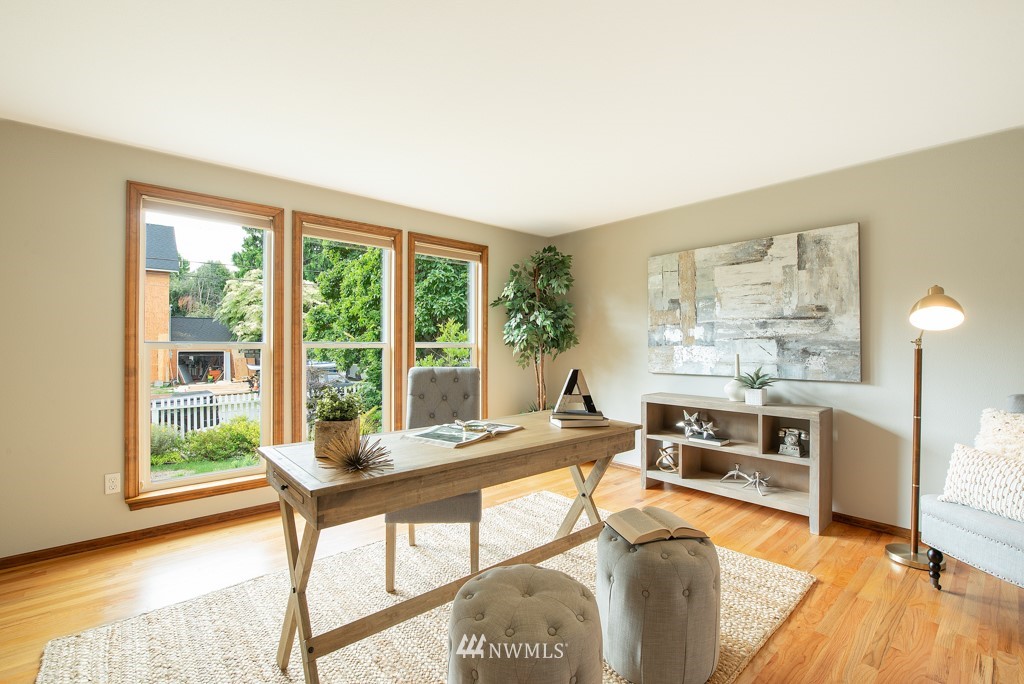 560 North 76th Street Seattle, WA 98103 - Photo 5 of 37 a living room with furniture and a large window
