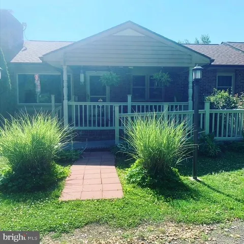 a view of a pathway in front of house