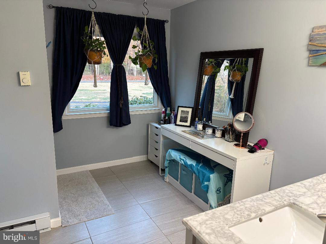 1960 Erica Road Montross, VA 22520 - Photo 29 of 35 a bathroom with a sink vanity and mirror