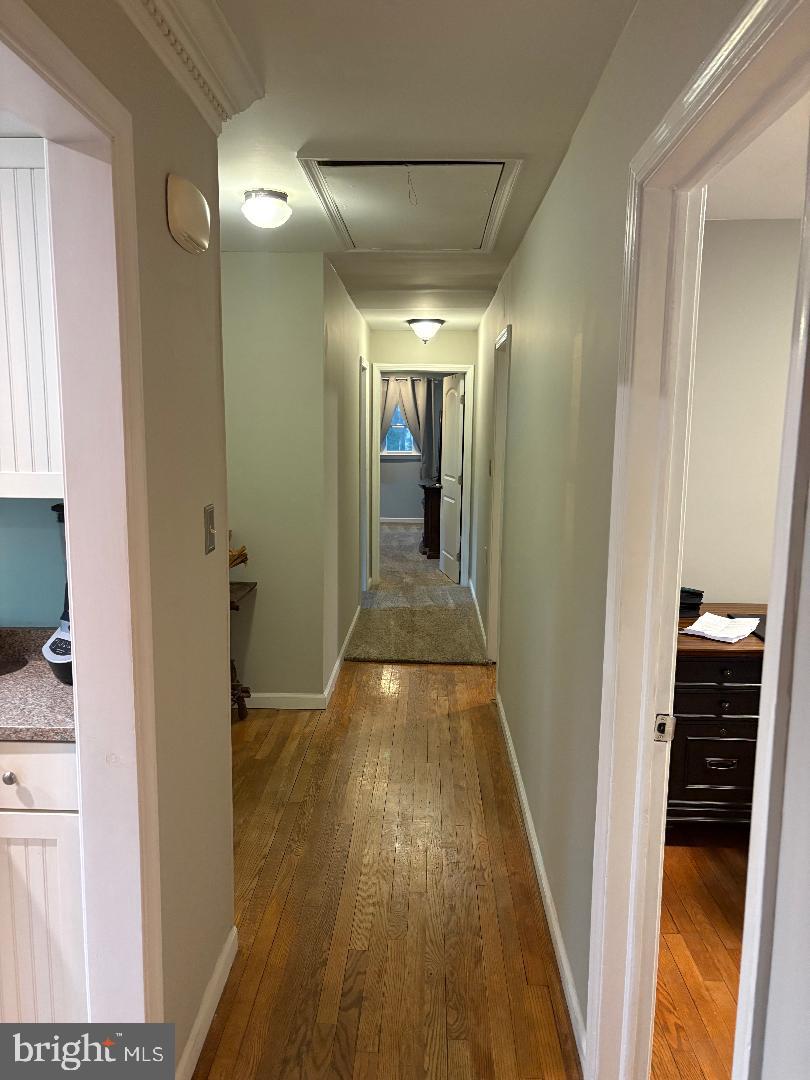 1960 Erica Road Montross, VA 22520 - Photo 35 of 35 a view of a hallway with wooden floor and staircase
