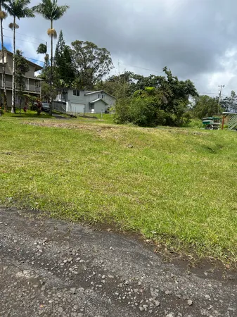 a view of a field with an ocean