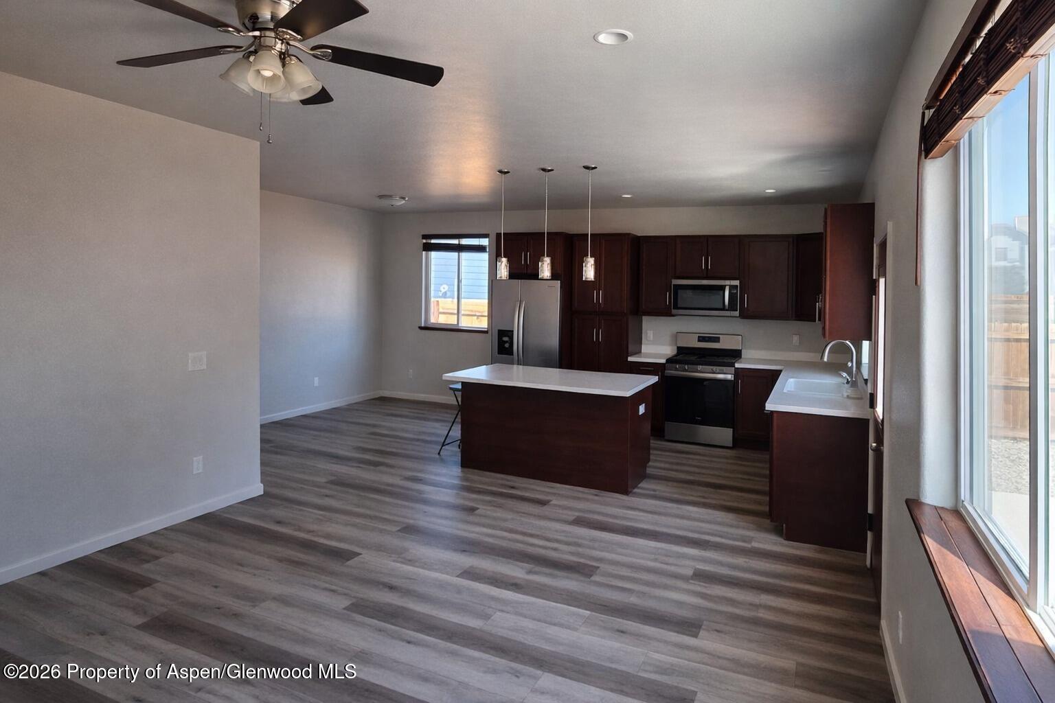 1648 Arabian Avenue Rifle, CO 81650 - Photo 6 of 15 a living room with furniture and a wooden floor