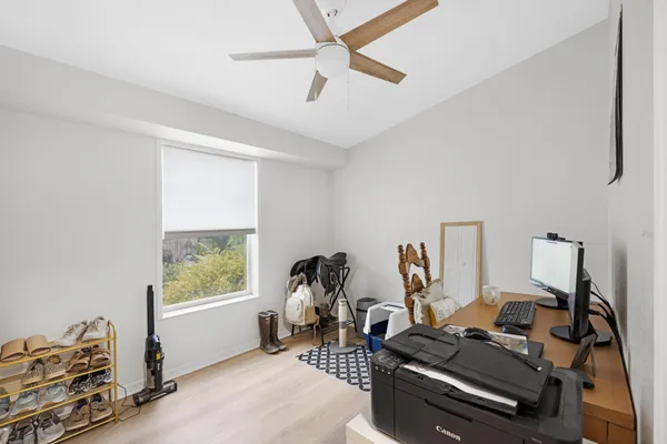 a room with gym equipment and a window