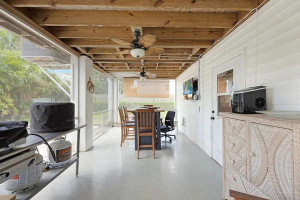 a view of a livingroom with furniture and flat screen tv