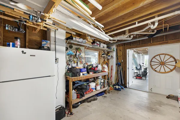 a front view of a house with a tree