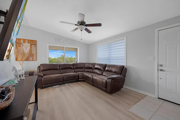 a living room with furniture and a window