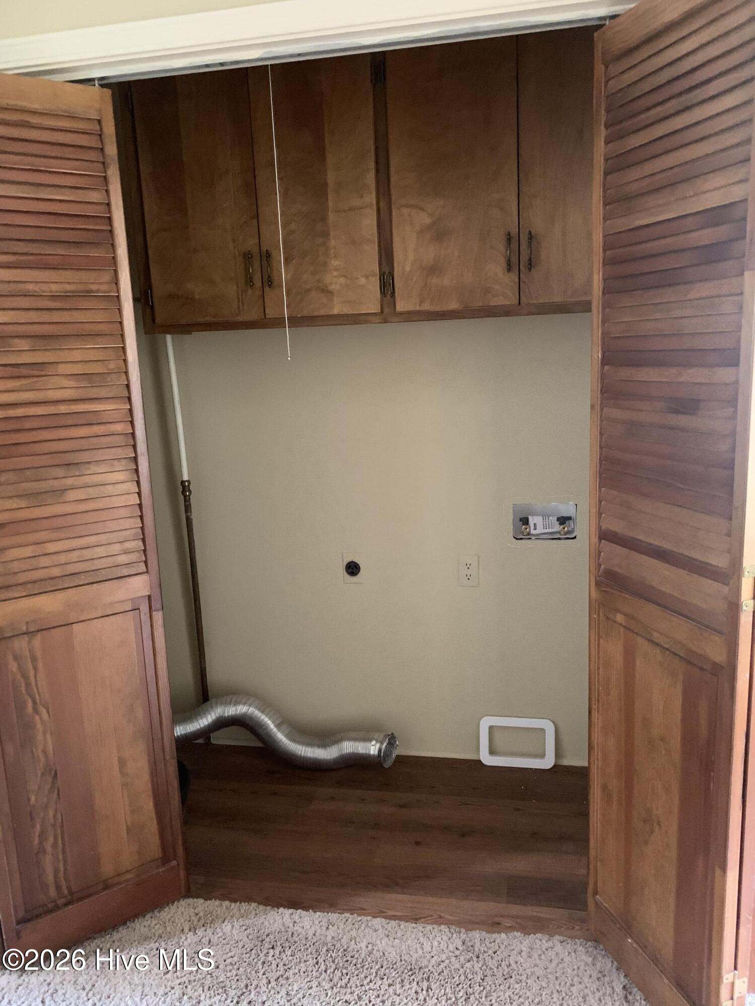 1129 Strawbush Road Rocky Mount, NC 27804 - Photo 14 of 28 Laundry closet at end of hall