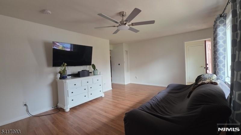 342 Sherman Street Passaic, NJ 07055 - Photo 15 of 32 a living room with furniture and a flat screen tv