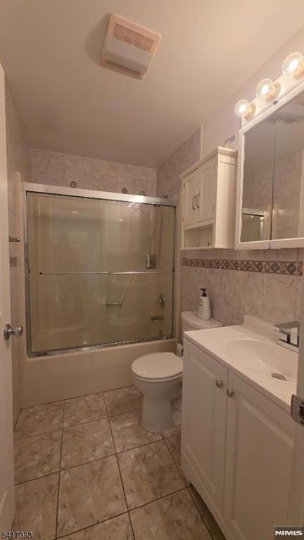 342 Sherman Street Passaic, NJ 07055 - Photo 18 of 32 a bathroom with a sink a toilet and shower