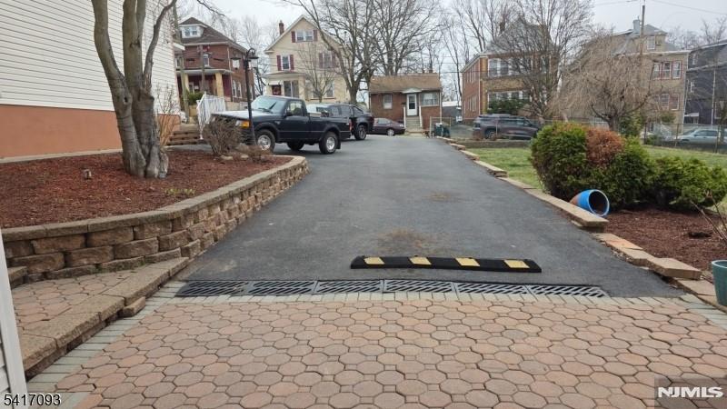342 Sherman Street Passaic, NJ 07055 - Photo 23 of 32 a view of a street with cars on road