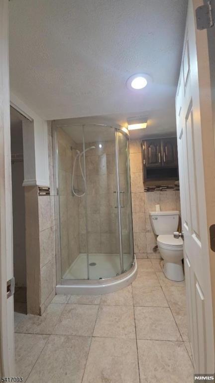 342 Sherman Street Passaic, NJ 07055 - Photo 26 of 32 a bathroom with a shower a toilet and a sink