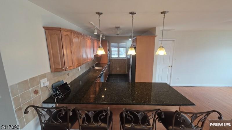 342 Sherman Street Passaic, NJ 07055 - Photo 4 of 32 a view of a hall with furniture and floor to ceiling window