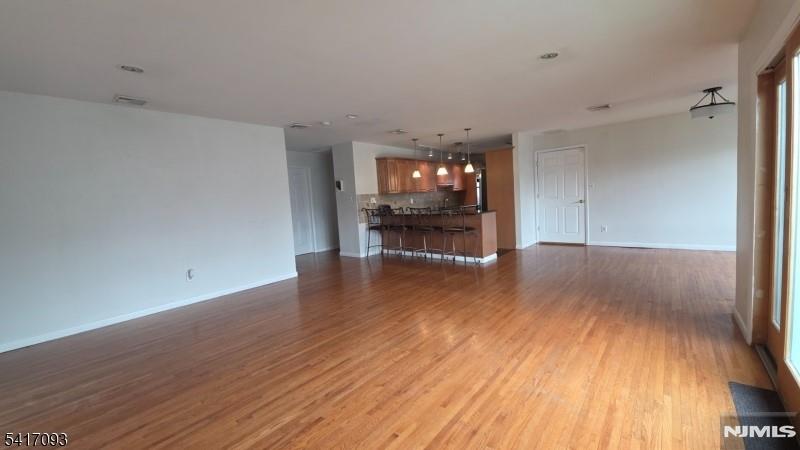 342 Sherman Street Passaic, NJ 07055 - Photo 8 of 32 a view of empty room with wooden floor