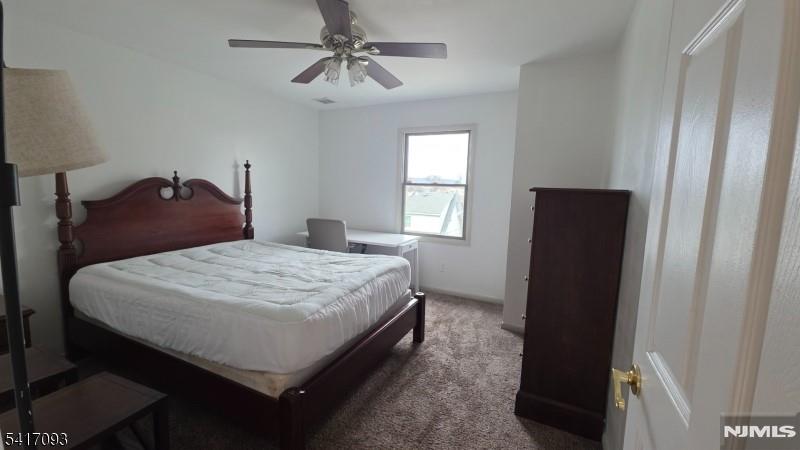 342 Sherman Street Passaic, NJ 07055 - Photo 10 of 32 a bedroom with a bed and a window