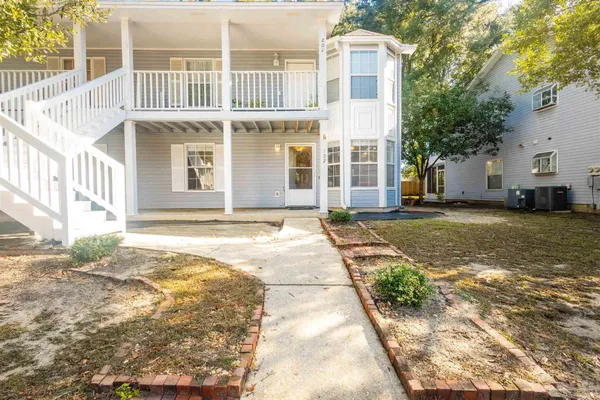 a front view of a house with a yard