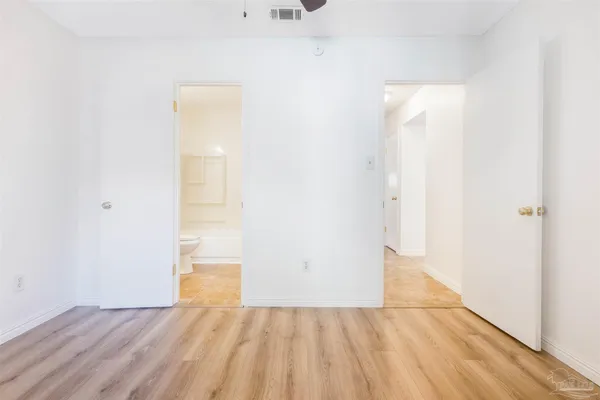 a bathroom with a sink toilet vanity and bathtub