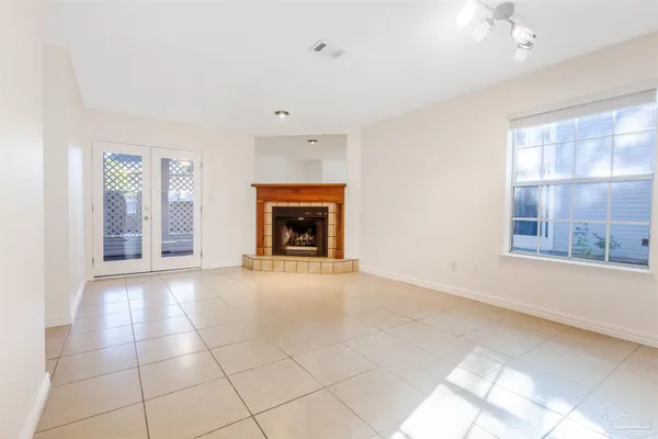 a view of an empty room with a fireplace