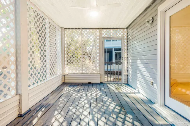 a view of wooden door with a bench